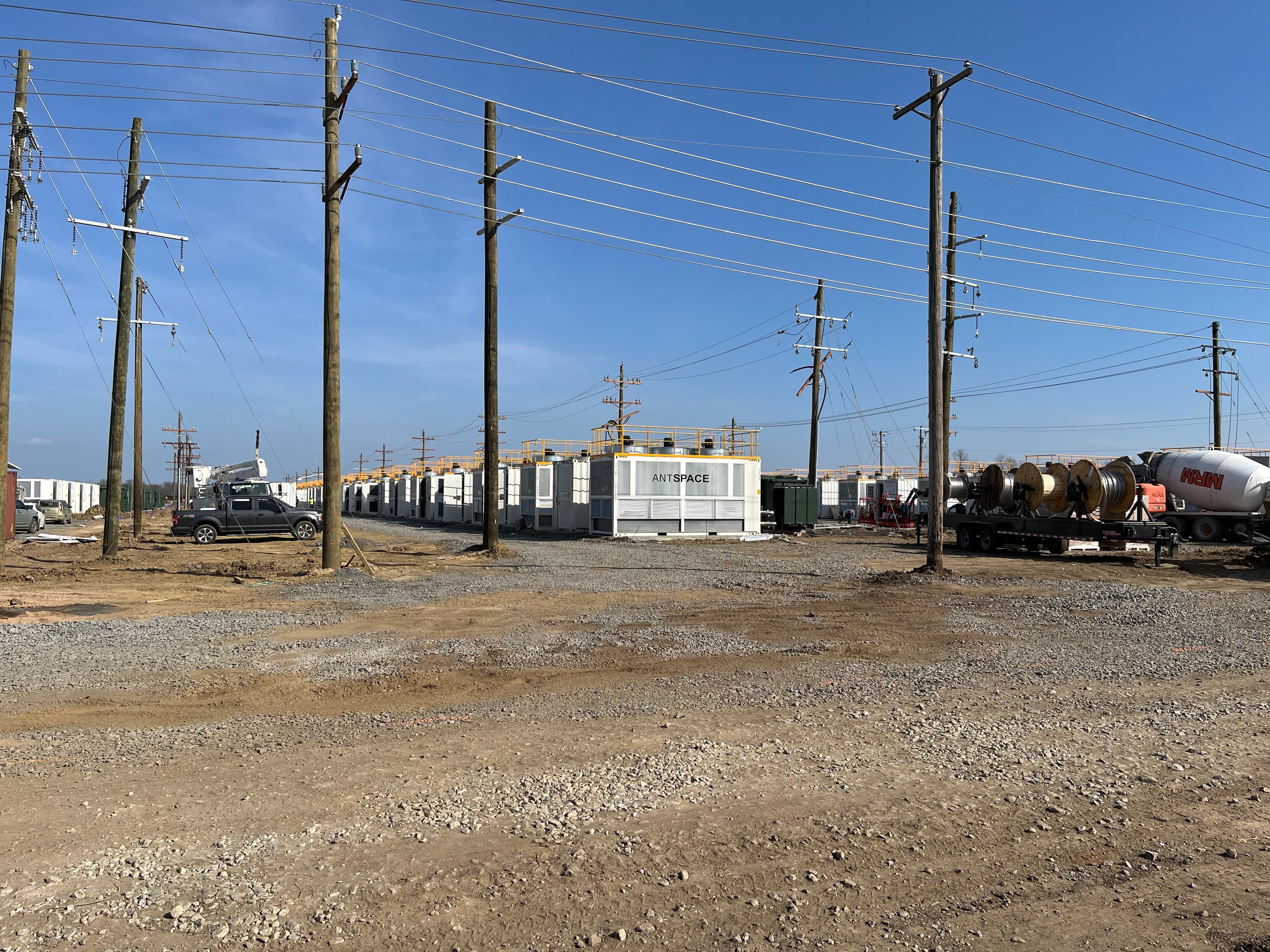 Rows of ANTSPACE modular units at a greenfield site with utility infrastructure